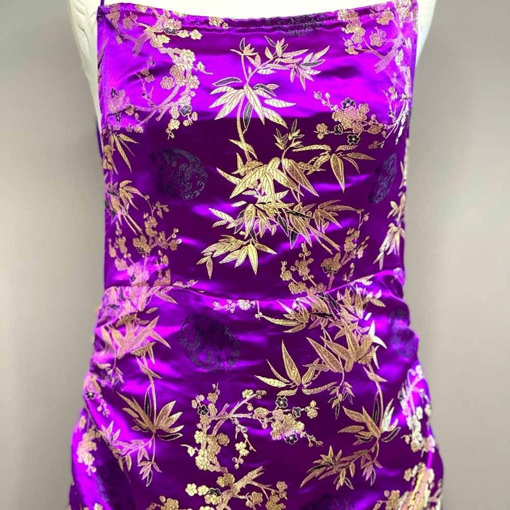 Purple mini dress with printed pattern and open crisscrossed back.